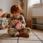 Child building a LinkKit fried egg small case textile kit for hands-on creative play