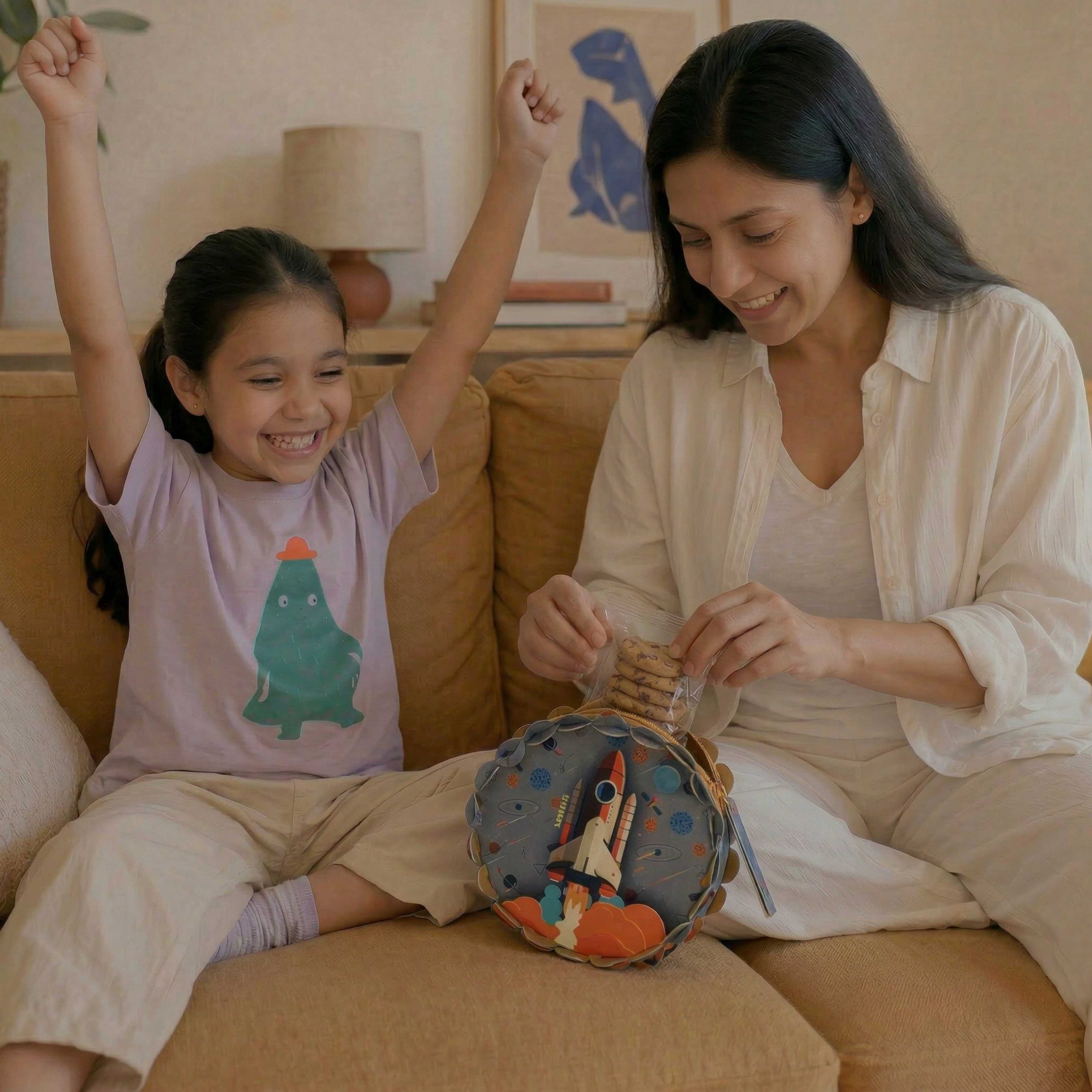 Child and mother building a LinkKit starship large pouch textile kit at home